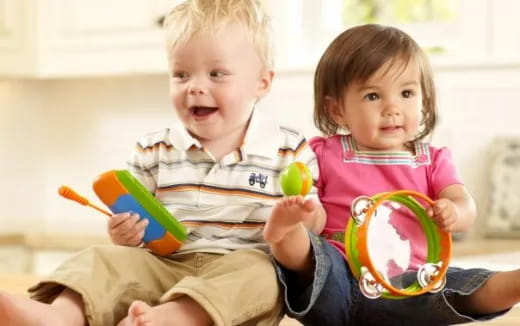 a couple of children playing with toys