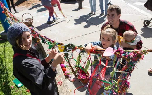 a group of people holding balloons