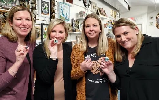 a group of women holding candy