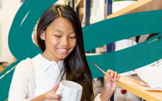 a young girl painting