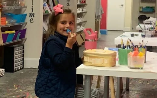 a girl brushing her teeth