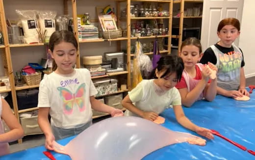 a group of children sitting on the floor