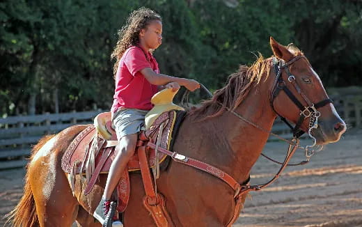 a girl riding a horse