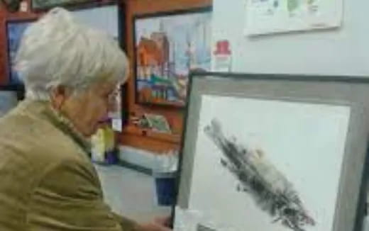 a man painting a picture