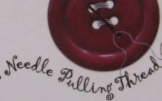 a red heart with a black pen