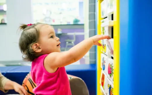 a young girl playing with a toy
