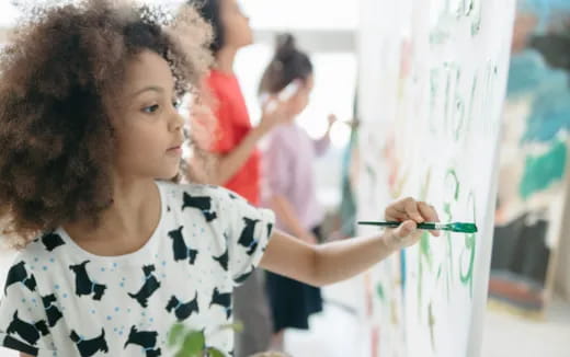 a young girl painting