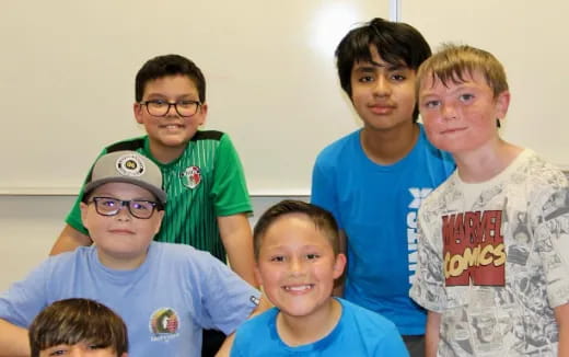 a group of boys posing for a photo