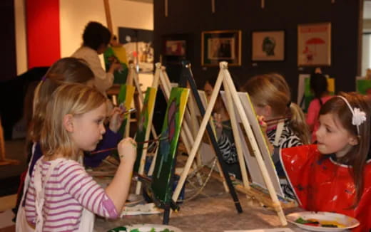 a group of children painting