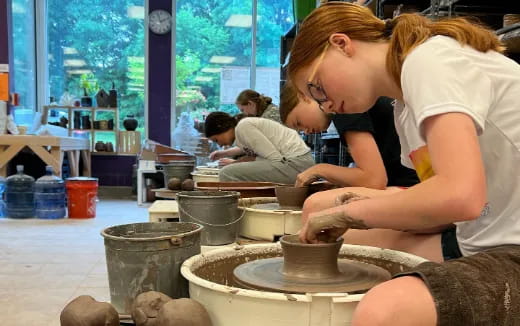 a person making a bowl
