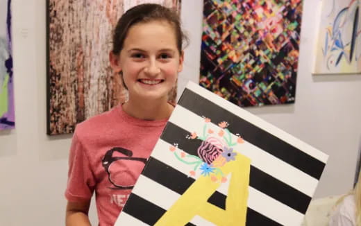 a girl holding a picture