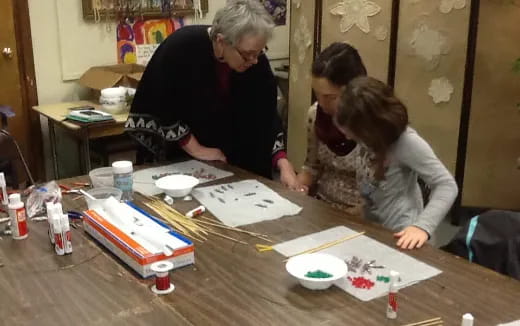 a group of people painting