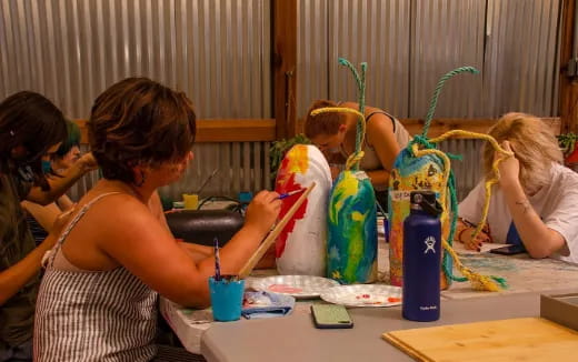 a group of people painting