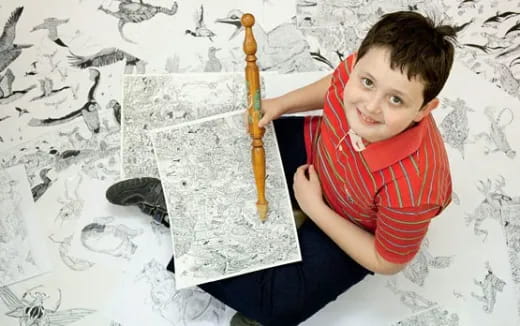 a boy holding a hammer