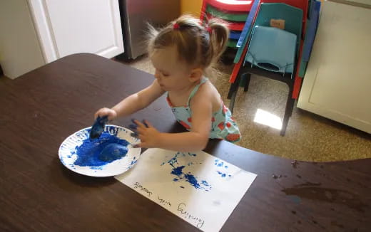 a little girl eating cake