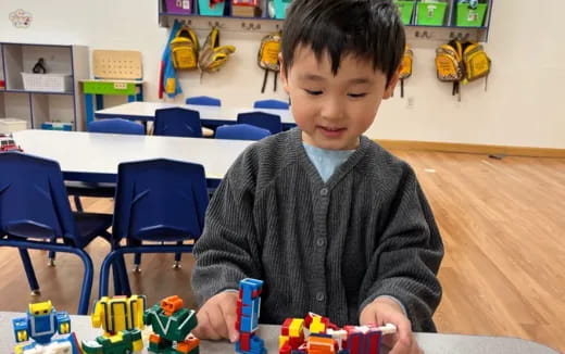 a boy playing with toys