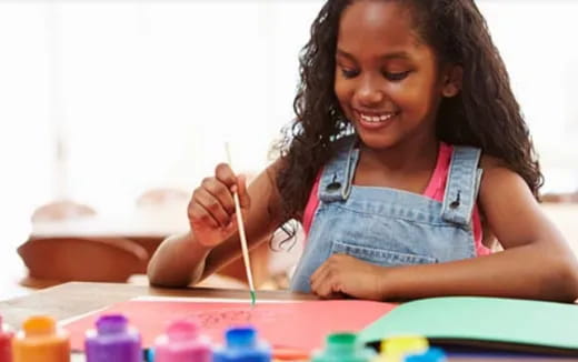 a young girl painting