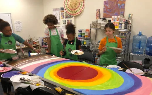 a group of kids painting