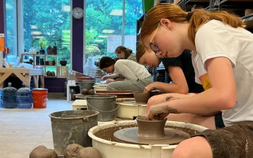 a person making a bowl