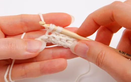 a person holding a white object