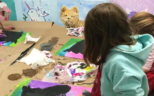 a group of children painting