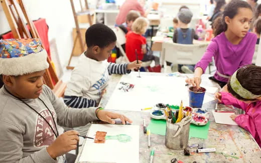 a group of children painting