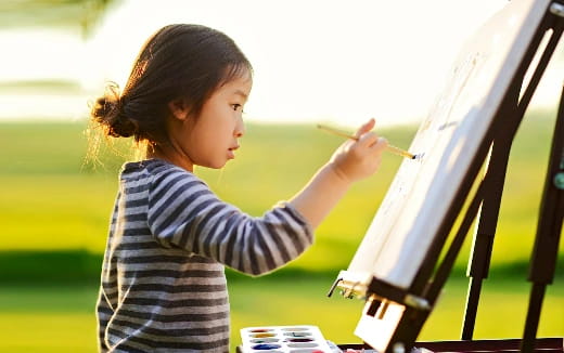 a young girl painting