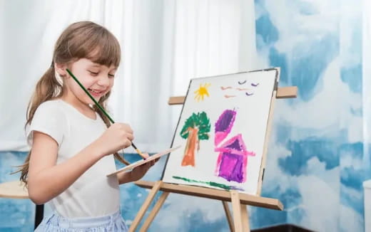 a young girl painting