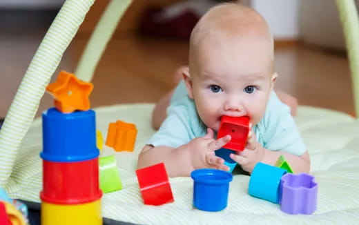 a baby playing with toys