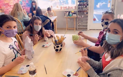 a group of people wearing masks