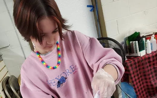 a woman wearing gloves