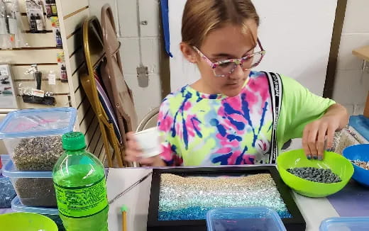 a young girl in a kitchen