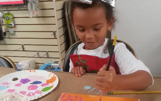 a young girl painting