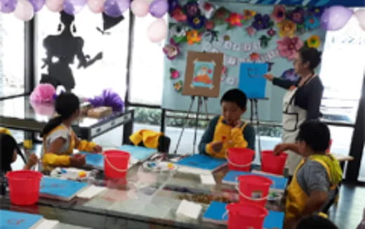 a group of children painting