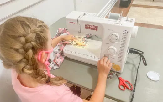 a girl opening a microwave