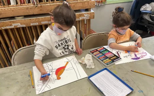 children painting on a table