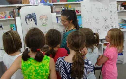 a teacher teaching her students