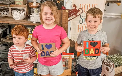 a group of children holding signs