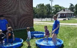 a group of children playing in a yard