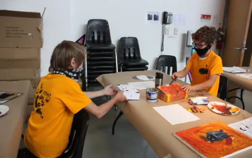 a few kids wearing masks