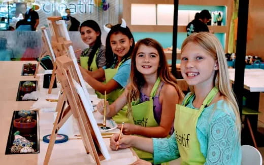 a group of girls painting