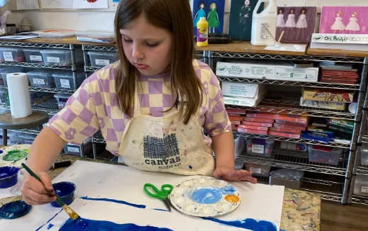 a young girl painting