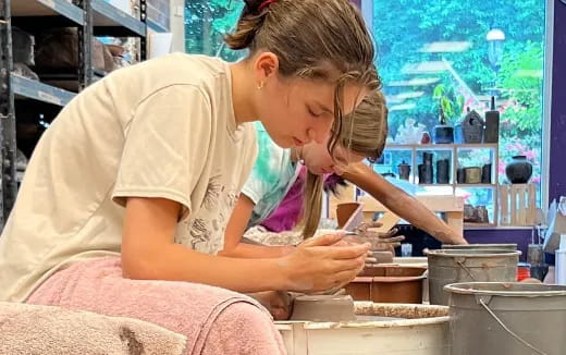 a person making a doughnut