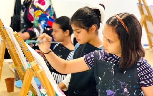 a group of children painting