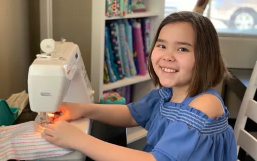 a girl holding a microscope