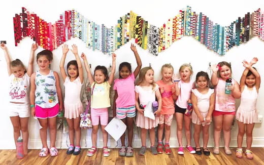 a group of girls posing for a photo