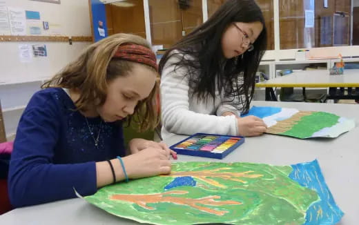 a few young girls painting