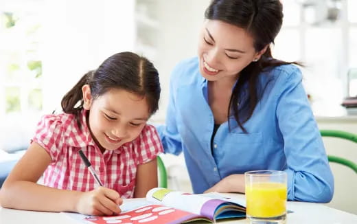 a woman and a child studying