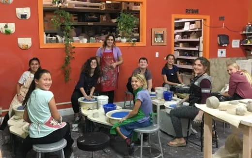 a group of people sitting around a table