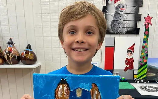 a boy smiling at the camera